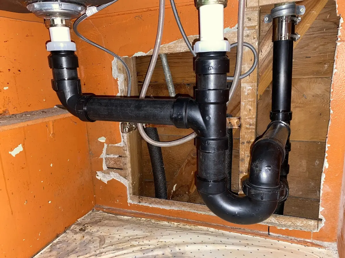 Professional Garbage Disposal Repair equipment and tools on the job in Leland